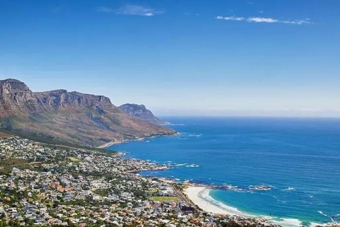 Framed Print : Aerial panorama photo of Camps Bay. Aerial view of town near sea against sky Framed Print : Aerial panorama photo of Camps Bay. Aerial view of town near sea against sky