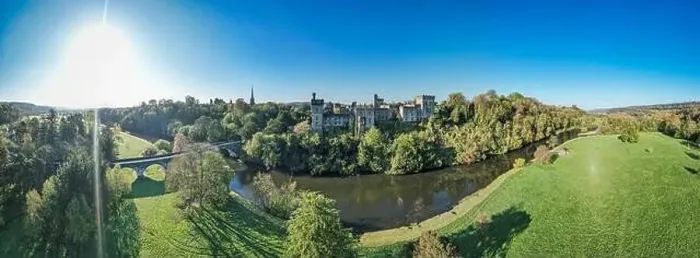 Framed Print : An aerial panorama reveals the majestic Lismore Castle in County Waterford, Ireland, set against a flawless spring sky Framed Print : An aerial panorama reveals the majestic Lismore Castle in County Waterford, Ireland, set against a flawless spring sky