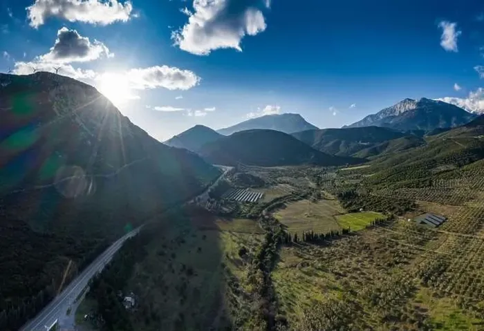 Framed Print : Aerial panorama of valley, morning fog over mountains, Twisting road, Tops and slopes of mountains Framed Print : Aerial panorama of valley, morning fog over mountains, Twisting road, Tops and slopes of mountains