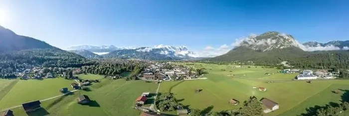 Framed Print : Aerial panorama view of Garmisch Partenkirchen Village with view of Zugspitze in fog Framed Print : Aerial panorama view of Garmisch Partenkirchen Village with view of Zugspitze in fog