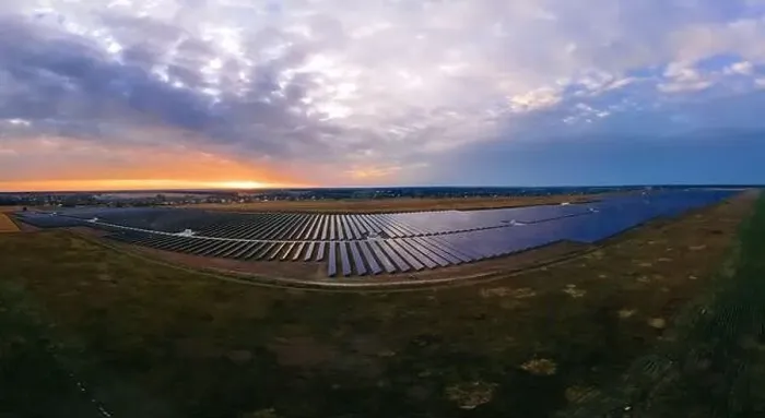 Framed Print : Aerial panorama view of large solar panels at a solar farm at bright summer sunset Framed Print : Aerial panorama view of large solar panels at a solar farm at bright summer sunset