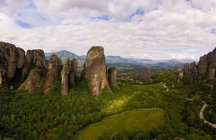 Framed Print : Aerial panorama view of a slide from a drone on a panorama of a mountain range Framed Print : Aerial panorama view of a slide from a drone on a panorama of a mountain range