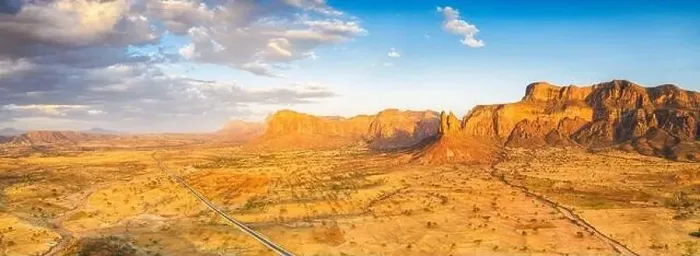 Framed Print : Aerial panoramic by drone of road at foot of Gheralta Mountains canyons, Hawzen, Tigray Region, Ethiopia, Africa Framed Print : Aerial panoramic by drone of road at foot of Gheralta Mountains canyons, Hawzen, Tigray Region, Ethiopia, Africa