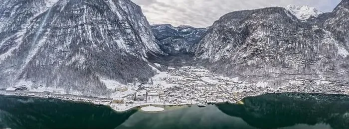 Framed Print : Aerial panoramic drone shot of Lahn village at foot of snow moun Framed Print : Aerial panoramic drone shot of Lahn village at foot of snow moun