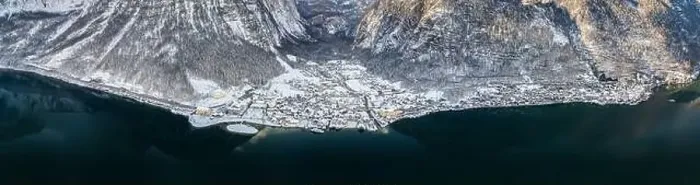 Framed Print : Aerial panoramic drone shot of snowy Lahn and Hallstatt village by lake in Austria during winter time with a bit of sun Framed Print : Aerial panoramic drone shot of snowy Lahn and Hallstatt village by lake in Austria during winter time with a bit of sun