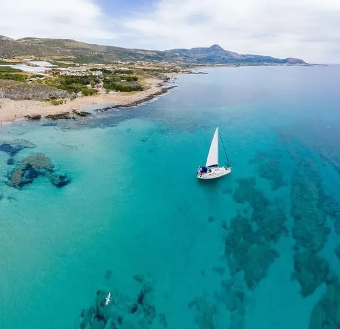 Framed Print : Aerial panoramic drone top view photo of sail boat sailing in mediterranean Aegean island of Crete Greece in summer Framed Print : Aerial panoramic drone top view photo of sail boat sailing in mediterranean Aegean island of Crete Greece in summer