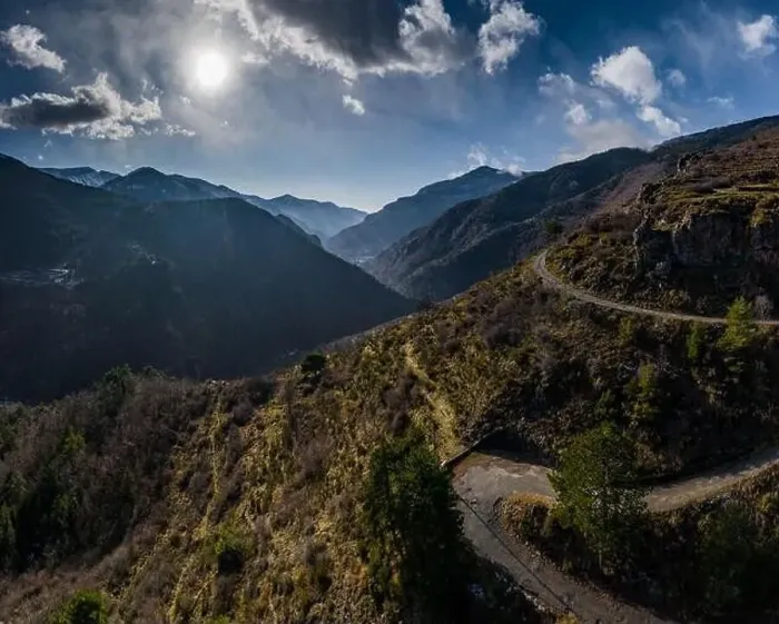 Framed Print : Aerial panoramic drone view of a scenic highway by the beautiful Landscape covered in clouds and fog Framed Print : Aerial panoramic drone view of a scenic highway by the beautiful Landscape covered in clouds and fog