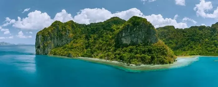 Framed Print : Aerial panoramic drone view of uninhabited tropical island with towering mountains Framed Print : Aerial panoramic drone view of uninhabited tropical island with towering mountains