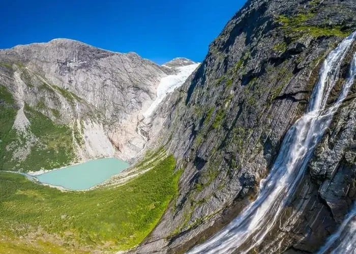 Framed Print : Aerial panoramic by drone of waterfall above Briksdalsbreen glacier Framed Print : Aerial panoramic by drone of waterfall above Briksdalsbreen glacier
