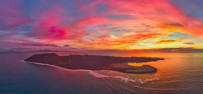 Framed Print : Aerial panoramic image of a dramatic sunrise over Lobos island Corralejo Fuerteventura Framed Print : Aerial panoramic image of a dramatic sunrise over Lobos island Corralejo Fuerteventura