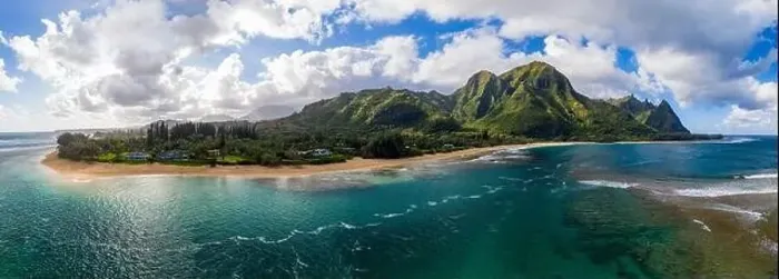 Framed Print : Aerial panoramic image off the coast over Tunnels beach on Hawaiian island of Kauai with Na Pali mountains behind Framed Print : Aerial panoramic image off the coast over Tunnels beach on Hawaiian island of Kauai with Na Pali mountains behind