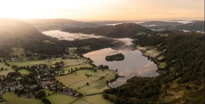 Framed Print : Aerial panoramic landscape of the Lake District village of Grasmere above Grasmere lake with low lying mist on a cold Framed Print : Aerial panoramic landscape of the Lake District village of Grasmere above Grasmere lake with low lying mist on a cold