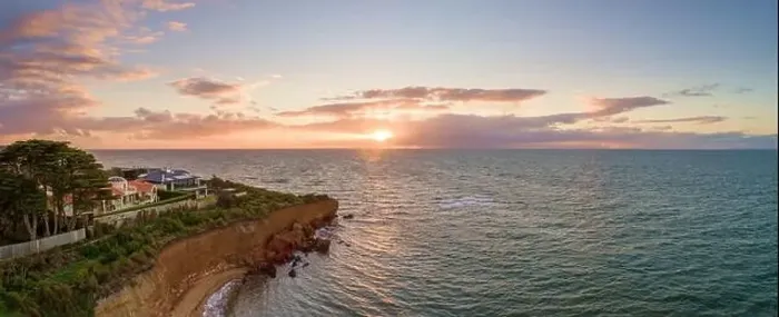 Framed Print : Aerial panoramic seascape of luxury houses on a cliff at sunset Framed Print : Aerial panoramic seascape of luxury houses on a cliff at sunset