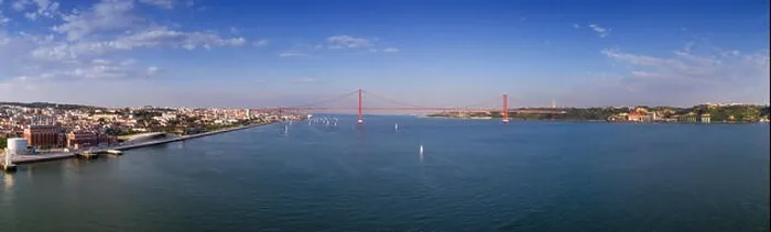 Framed Print : Aerial panoramic view of the city of Lisbon with sail boats on the Tagus River and the 25 of April Bridge Framed Print : Aerial panoramic view of the city of Lisbon with sail boats on the Tagus River and the 25 of April Bridge