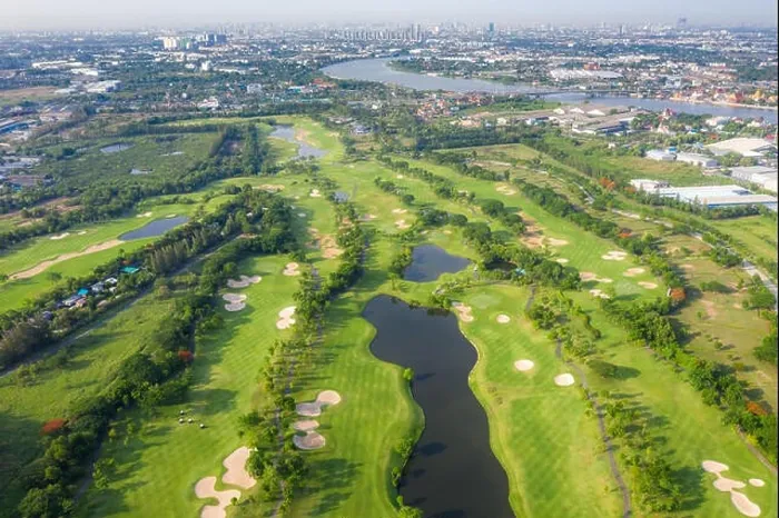 Framed Print : Aerial panoramic view of golf course and houses in city Framed Print : Aerial panoramic view of golf course and houses in city