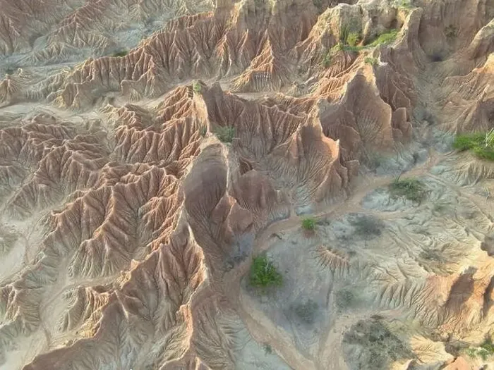 Framed Print : This aerial perspective captures the rugged terrain of the Tatacoa Desert Framed Print : This aerial perspective captures the rugged terrain of the Tatacoa Desert