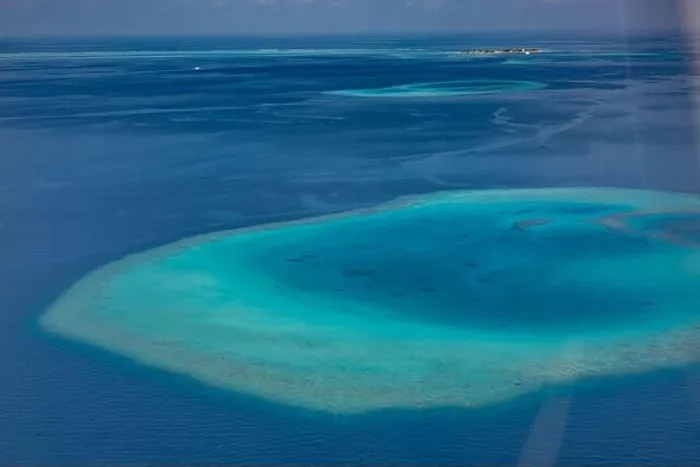 Framed Print : Aerial photo of beautiful paradise Maldives tropical lagoon with coral reef beach on island. Summer and travel vacation concept.View from seaplane Framed Print : Aerial photo of beautiful paradise Maldives tropical lagoon with coral reef beach on island. Summer and travel vacation concept.View from seaplane
