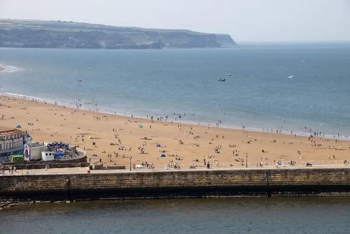 Framed Print : Aerial photo of the beautiful town of Whitby in the UK in North Yorkshire in the UK showing people on the sandy beach Framed Print : Aerial photo of the beautiful town of Whitby in the UK in North Yorkshire in the UK showing people on the sandy beach