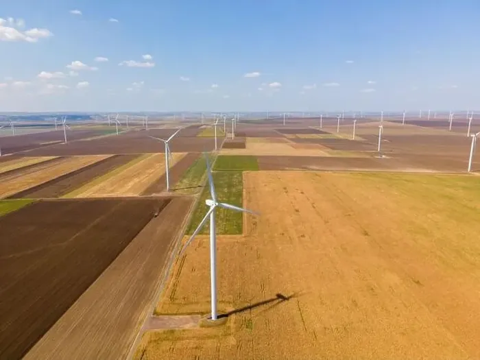 Framed Print : Aerial photography of a wind turbine from a wind farm in country side Framed Print : Aerial photography of a wind turbine from a wind farm in country side