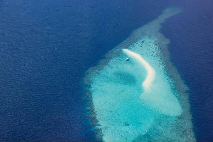 Framed Print : Aerial picture of turquoise blue tropical ocean lagoon, white sandy beach, sandbank coral reef shallow water with boat. Nature perfection in Maldives Framed Print : Aerial picture of turquoise blue tropical ocean lagoon, white sandy beach, sandbank coral reef shallow water with boat. Nature perfection in Maldives