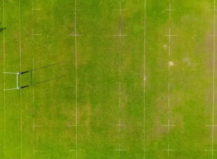 Framed Print : An aerial shot captured by a drone showcasing a detailed perspective of a lush green sports field Framed Print : An aerial shot captured by a drone showcasing a detailed perspective of a lush green sports field