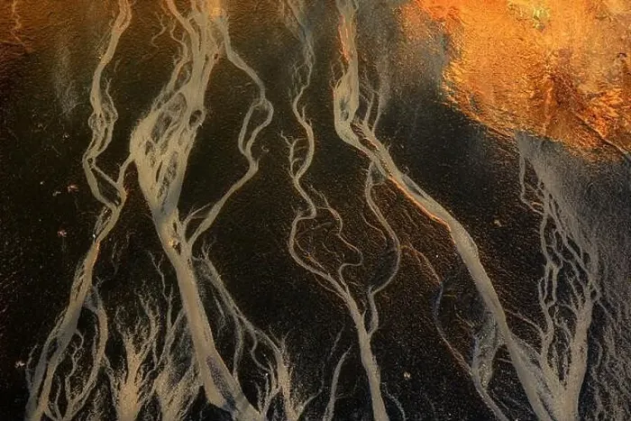 Framed Print : An aerial shot captures the intriguing patterns of a river delta Framed Print : An aerial shot captures the intriguing patterns of a river delta