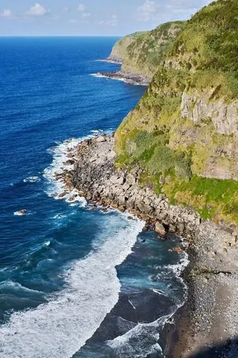 Framed Print : Aerial shot drone point of view green hills and Atlantic Ocean surf during sunny summer day Framed Print : Aerial shot drone point of view green hills and Atlantic Ocean surf during sunny summer day