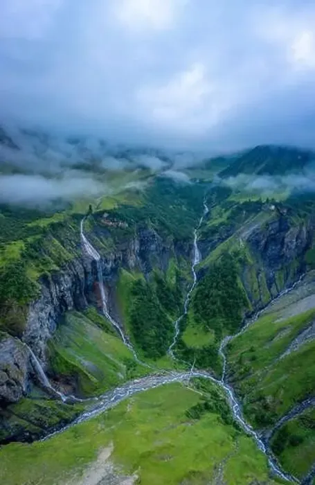 Framed Print : Aerial shot of several large waterfalls cascading down a steep cliff Framed Print : Aerial shot of several large waterfalls cascading down a steep cliff