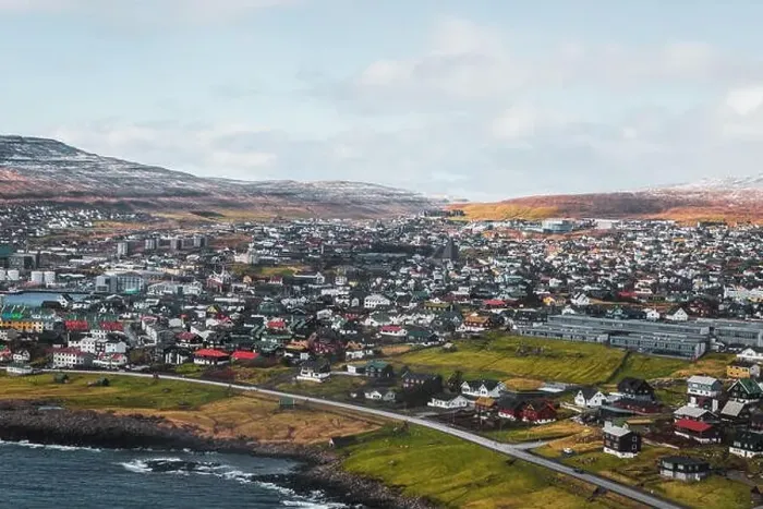 Framed Print : Aerial shot of the town Torshavn as taken during a helicopter flight on an early spring morning with snow-covered Framed Print : Aerial shot of the town Torshavn as taken during a helicopter flight on an early spring morning with snow-covered