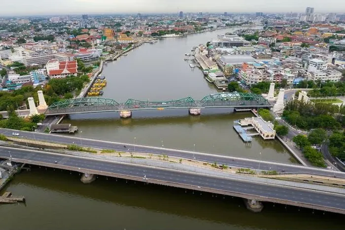 Framed Print : Aerial shots taken from a drone of Phra Pok Klao Bridge and Phra Phuttha Yot Fa Bridge. crossing the Chao Phraya River in the morning with temple Framed Print : Aerial shots taken from a drone of Phra Pok Klao Bridge and Phra Phuttha Yot Fa Bridge. crossing the Chao Phraya River in the morning with temple