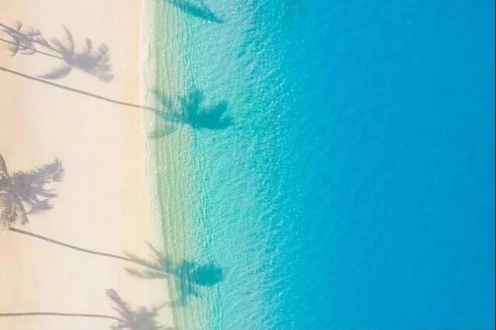 Framed Print : Aerial sunset beach, beautiful coastline. Palm trees and amazing sea lagoon. Turquoise water, white sand with palm tree shadow, tropical paradise Framed Print : Aerial sunset beach, beautiful coastline. Palm trees and amazing sea lagoon. Turquoise water, white sand with palm tree shadow, tropical paradise