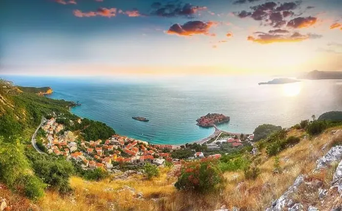 Framed Print : Aerial sunset view of the islet Sveti Stefan from church st Framed Print : Aerial sunset view of the islet Sveti Stefan from church st