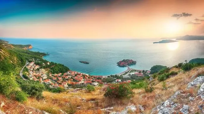 Framed Print : Aerial sunset view of the islet Sveti Stefan from church st Framed Print : Aerial sunset view of the islet Sveti Stefan from church st