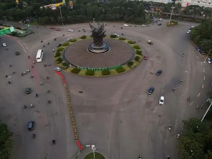 Framed Print : Aerial top down of traffic in Bekasi roundabout during sunny day. Cars passing road. Bekasi. Indonesia. May, 6 2021 Framed Print : Aerial top down of traffic in Bekasi roundabout during sunny day. Cars passing road. Bekasi. Indonesia. May, 6 2021