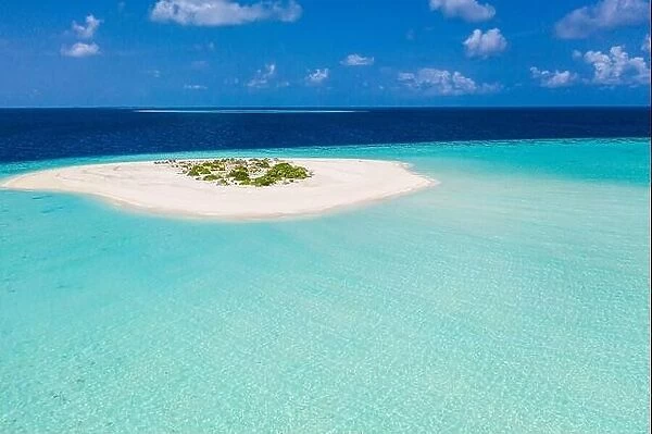 Aerial tropical paradise, small island in shallow blue lagoon. Ocean water, deep sea endless horizon. Amazing relaxing travel destination backgroud