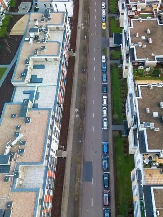 Framed Print : A top aerial, vertical view of a modern street in an apartment complex with bicycle paths and street Framed Print : A top aerial, vertical view of a modern street in an apartment complex with bicycle paths and street