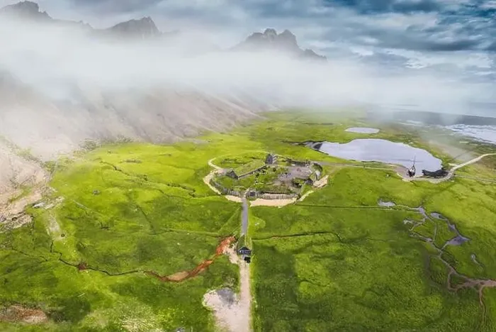 Framed Print : Aerial view of abandoned icelandic viking village on wilderness near Vestrahorn mountain during summer at Stokksnes Framed Print : Aerial view of abandoned icelandic viking village on wilderness near Vestrahorn mountain during summer at Stokksnes