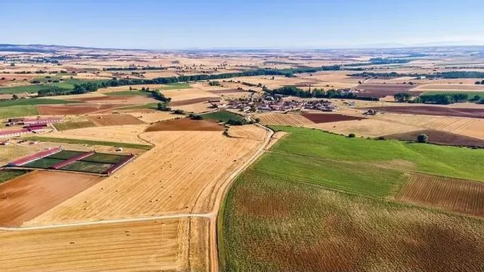 Framed Print : Aerial view of agricultural fields and rural town in the background. Segovia Framed Print : Aerial view of agricultural fields and rural town in the background. Segovia