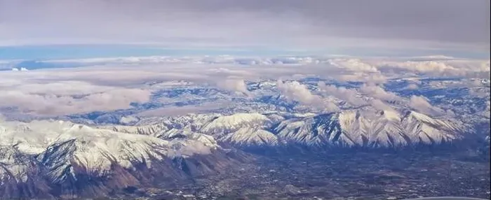 Framed Print : Aerial view from airplane of the Wasatch Front Rocky Mountain Range with snow capped peaks in winter including urban