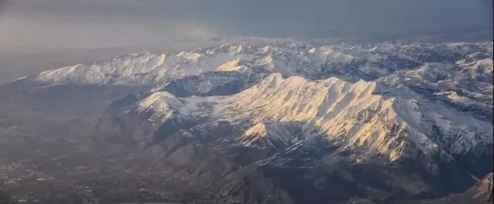 Framed Print : Aerial view from airplane of the Wasatch Front Rocky Mountain Range with snow capped peaks in winter including urban Framed Print : Aerial view from airplane of the Wasatch Front Rocky Mountain Range with snow capped peaks in winter including urban