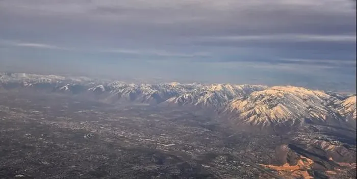 Framed Print : Aerial view from airplane of the Wasatch Front Rocky Mountain Range with snow capped peaks in winter including urban Framed Print : Aerial view from airplane of the Wasatch Front Rocky Mountain Range with snow capped peaks in winter including urban