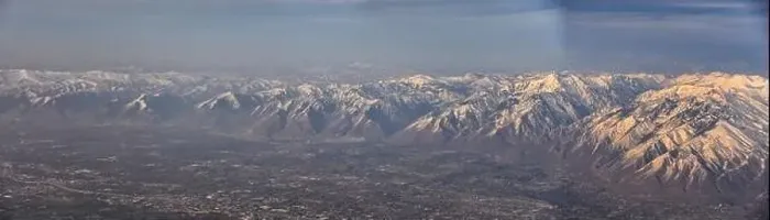 Framed Print : Aerial view from airplane of the Wasatch Front Rocky Mountain Range with snow capped peaks in winter including urban