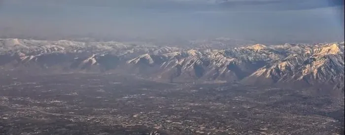 Framed Print : Aerial view from airplane of the Wasatch Front Rocky Mountain Range with snow capped peaks in winter including urban Framed Print : Aerial view from airplane of the Wasatch Front Rocky Mountain Range with snow capped peaks in winter including urban