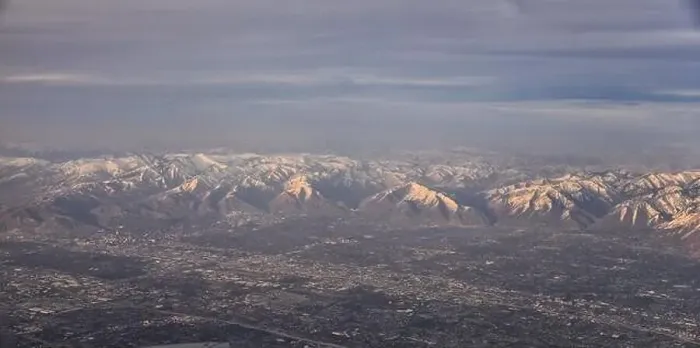 Framed Print : Aerial view from airplane of the Wasatch Front Rocky Mountain Range with snow capped peaks in winter including urban Framed Print : Aerial view from airplane of the Wasatch Front Rocky Mountain Range with snow capped peaks in winter including urban