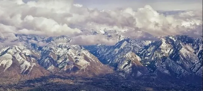 Framed Print : Aerial view from airplane of the Wasatch Front Rocky Mountain Range with snow capped peaks in winter including urban Framed Print : Aerial view from airplane of the Wasatch Front Rocky Mountain Range with snow capped peaks in winter including urban