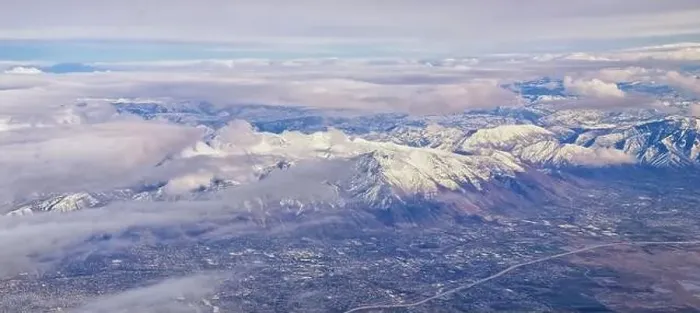 Framed Print : Aerial view from airplane of the Wasatch Front Rocky Mountain Range with snow capped peaks in winter including urban Framed Print : Aerial view from airplane of the Wasatch Front Rocky Mountain Range with snow capped peaks in winter including urban