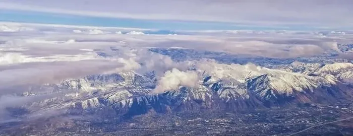 Framed Print : Aerial view from airplane of the Wasatch Front Rocky Mountain Range with snow capped peaks in winter including urban Framed Print : Aerial view from airplane of the Wasatch Front Rocky Mountain Range with snow capped peaks in winter including urban