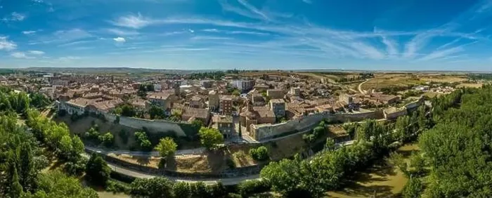 Framed Print : Aerial view of Almazan city walls, fortified gate, battlements above the Ebro river in Spain with cloudy blue sky Framed Print : Aerial view of Almazan city walls, fortified gate, battlements above the Ebro river in Spain with cloudy blue sky