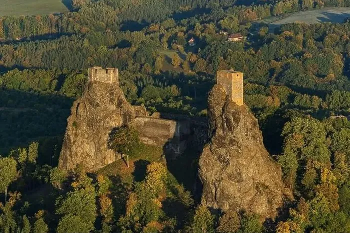 Framed Print : Aerial view of ancient ruined Trosky Castle high on summits of two basalt volcanic plugs on background of autumn Framed Print : Aerial view of ancient ruined Trosky Castle high on summits of two basalt volcanic plugs on background of autumn