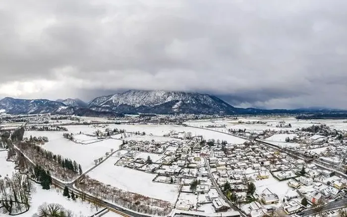 Framed Print : Aerial view of Austrian Alps valley village near Untersberg mountain and Salzburg outskirts in winter during heavy snow Framed Print : Aerial view of Austrian Alps valley village near Untersberg mountain and Salzburg outskirts in winter during heavy snow